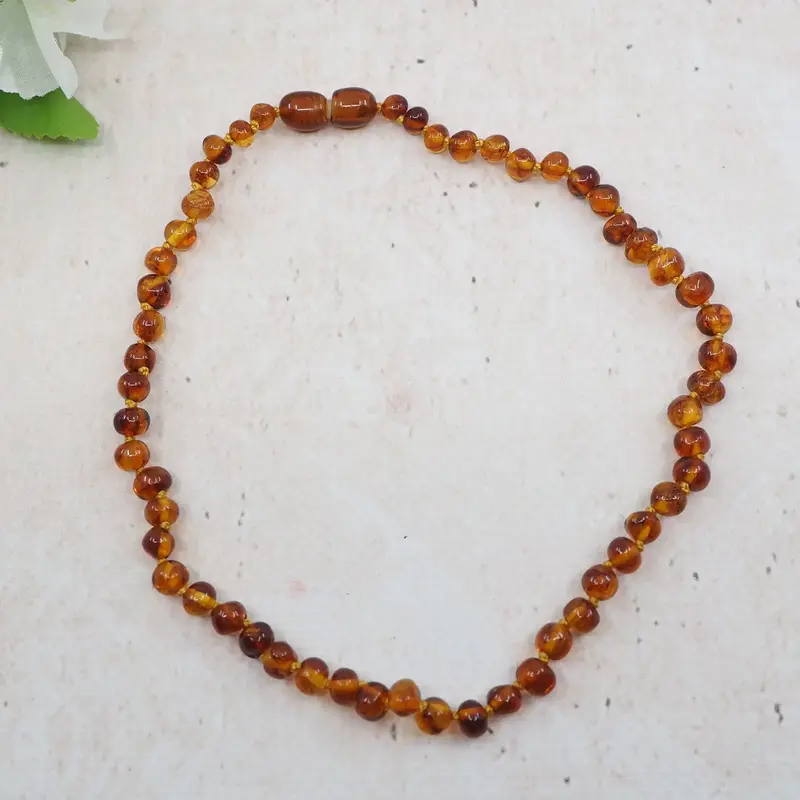 Collier d'ambre pour bébé - Baroque Cognac