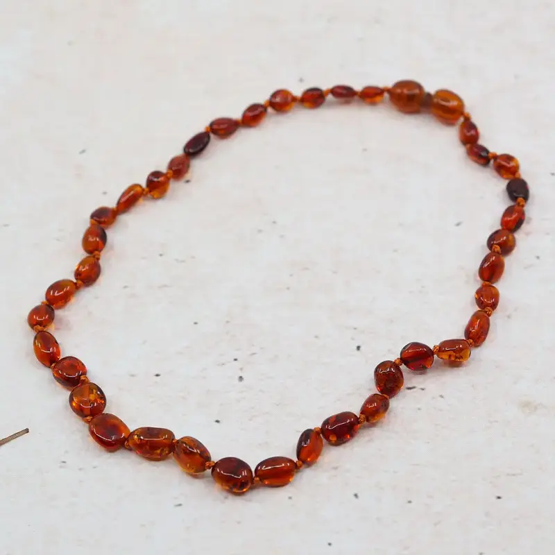 Collier d'ambre pour bébé - Olive Cognac