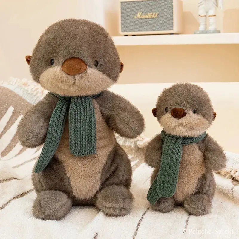 Peluche Loutre avec écharpe.